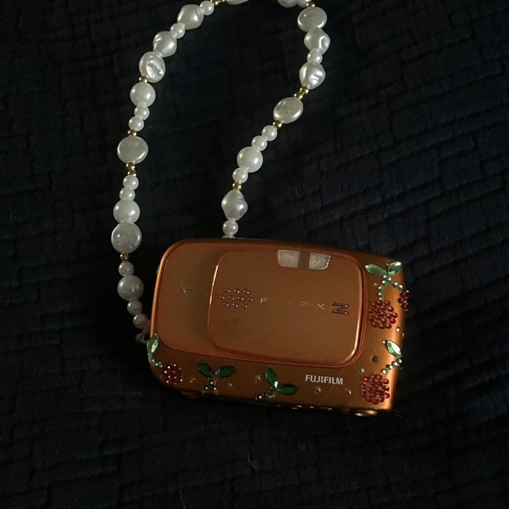 Fujifilm Orange Camera with Floral Accents and Leopard Case